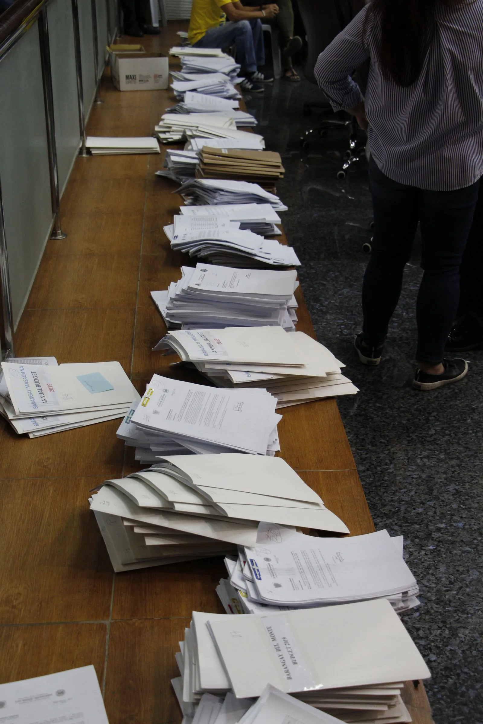 A stack of document pages being combined, illustrating how to merge PDF files
