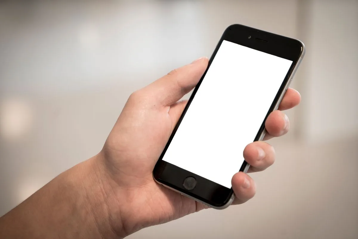 Hand holding a smartphone with the Docu Stop PDF app
