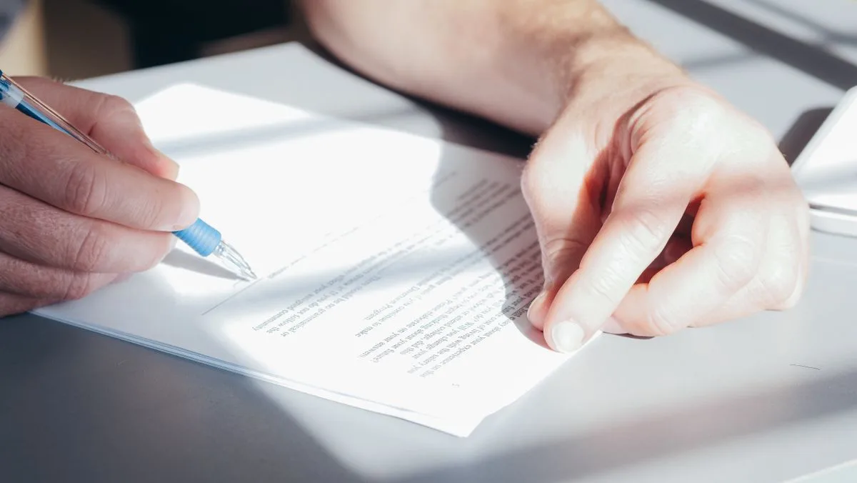 A person securing signed documents, illustrating how to protect a PDF with a password
